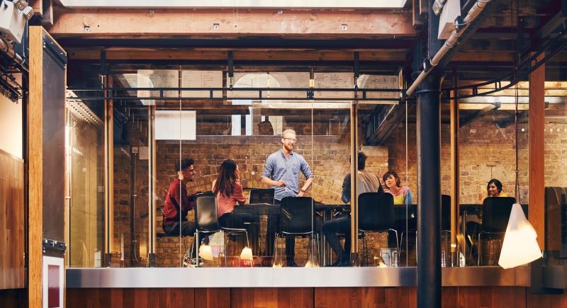 Team working in glass office